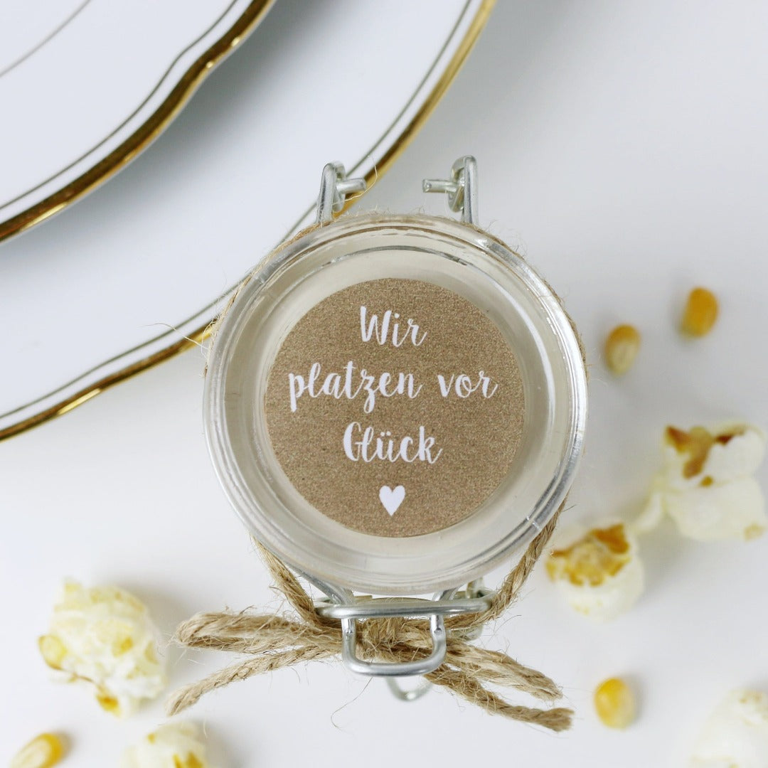 Gastgeschenk Aufkleber mit Spruch wir platzen vor Glück